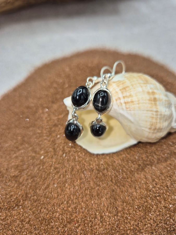 Boucles d'oreilles en black star double